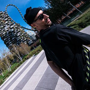 Good Flow practicing in front of Milan's Bosco Verticale with his Court SP rope on a bright day
